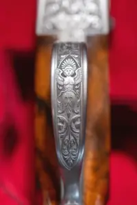 Verzierung an einer Jagdwaffe